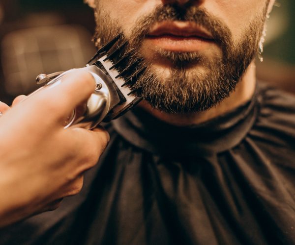 Handsome man at barbershop shaving beard Handsome man at barbershop shaving beard